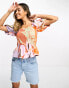 River Island abstract print shirred waist puff sleeve peplum blouse in orange