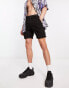 ASOS DESIGN skinny chino shorts in mid length in black