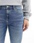 ASOS DESIGN skinny jeans in mid wash blue