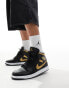 Air Jordan 1 mid trainers in black and gold