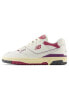 New Balance 550 trainers in white with pink detail