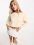 Calvin Klein Jeans cropped crew neck seaming sweatshirt in beige - exclusive to ASOS