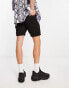 ASOS DESIGN skinny chino shorts in mid length in black