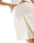 Edited pleated mini skirt co-ord in cream