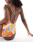 ASOS DESIGN lattice strap swimsuit with high leg in vibrant abstract print