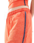 COLLUSION oversized longline sports short in red