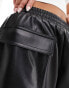 ASOS DESIGN leather look turn up utility shorts in black