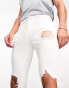 ASOS DESIGN spray on jeans with power stretch with heavy rips in white