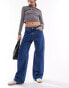 Monki Naoki low rise loose fit jeans in classic blue wash