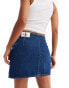 Calvin Klein Jeans mid rise a line darted mini skirt in mid wash