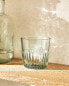 Raised design glass tumbler