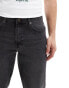 ASOS DESIGN tapered jeans in washed black with tint