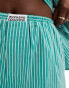 ASOS Weekend Collective boxer shorts with woven label in green stripe