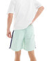 ASOS DESIGN nylon short in mint and navy side panels