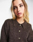 Object button through knitted top in brown