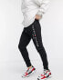 Tommy Hilfiger embroidered logo cuffed joggers in black