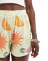 ASOS DESIGN holiday print boxer shorts in soft yellow