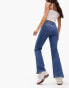 ASOS DESIGN Petite mid rise flare jeans in mid blue