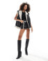 SNDYS leather look contrast borg detail mini skirt co-ord in black