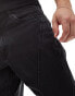 ASOS DESIGN tapered fit jeans with panelling detail in washed black - BLACK