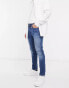 Tommy Jeans austin slim tapered jeans in mid wash