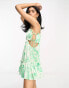 ASOS DESIGN ruched bust mini dress with tie detail and cut out in green floral print