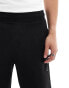 Calvin Klein shadow embossed logo jersey shorts in black