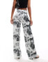 ASOS DESIGN wide leg satin twill trousers in distorted animal print