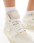 Nike Air Jordan 1 Mid trainers in off white and stone