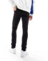 ASOS DESIGN skinny jeans in black with knee rips and zip detail