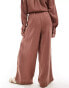 ASOS DESIGN wide leg trouser with pleat detail in textured fabric in rust co-ord