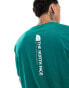 The North Face Vertical NSE logo backprint oversized t-shirt in dark green