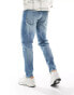 ASOS DESIGN stretch tapered jeans in mid wash blue