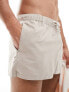 ASOS DESIGN swim shorts in super short length in beige