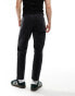 ASOS DESIGN tapered fit jeans with panelling detail in washed black - BLACK