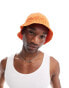 ASOS DESIGN knitted bucket hat in orange