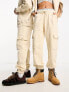 Calvin Klein Jeans unisex cargo joggers in beige - exclusive to ASOS