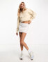 Calvin Klein Jeans cropped crew neck seaming sweatshirt in beige - exclusive to ASOS