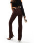 ASOS DESIGN rib slim flare trousers with back vent and gold belt in chocolate