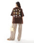 ASOS DESIGN oversized t-shirt with 70s lamp graphic in brown