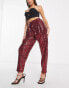 ASOS DESIGN sequin slouchy trouser in ruby