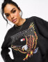 Tommy Jeans relaxed cropped vintage eagle crew neck sweatshirt in black