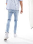 ASOS DESIGN skinny jeans in light wash blue with thigh rip