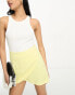 ASOS DESIGN wrap mini skirt with linen in yellow