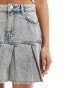 Monki low waist denim skirt with pleat raw hem in tinted blue wash