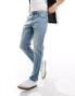 ASOS DESIGN tapered jeans in light wash blue