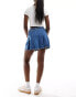 ASOS DESIGN denim pleated mini skirt with belt in midwash blue