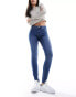 Vero Moda Alia mid rise skinny jeans with bum sculpt detail in medium blue