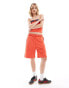 COLLUSION oversized longline sports short in red