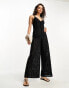 ASOS DESIGN Petite lace beach jumpsuit with cut out in black